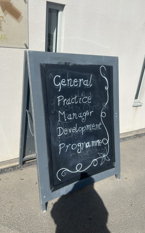 A sign with the words Practice Managers Development Programme written on it