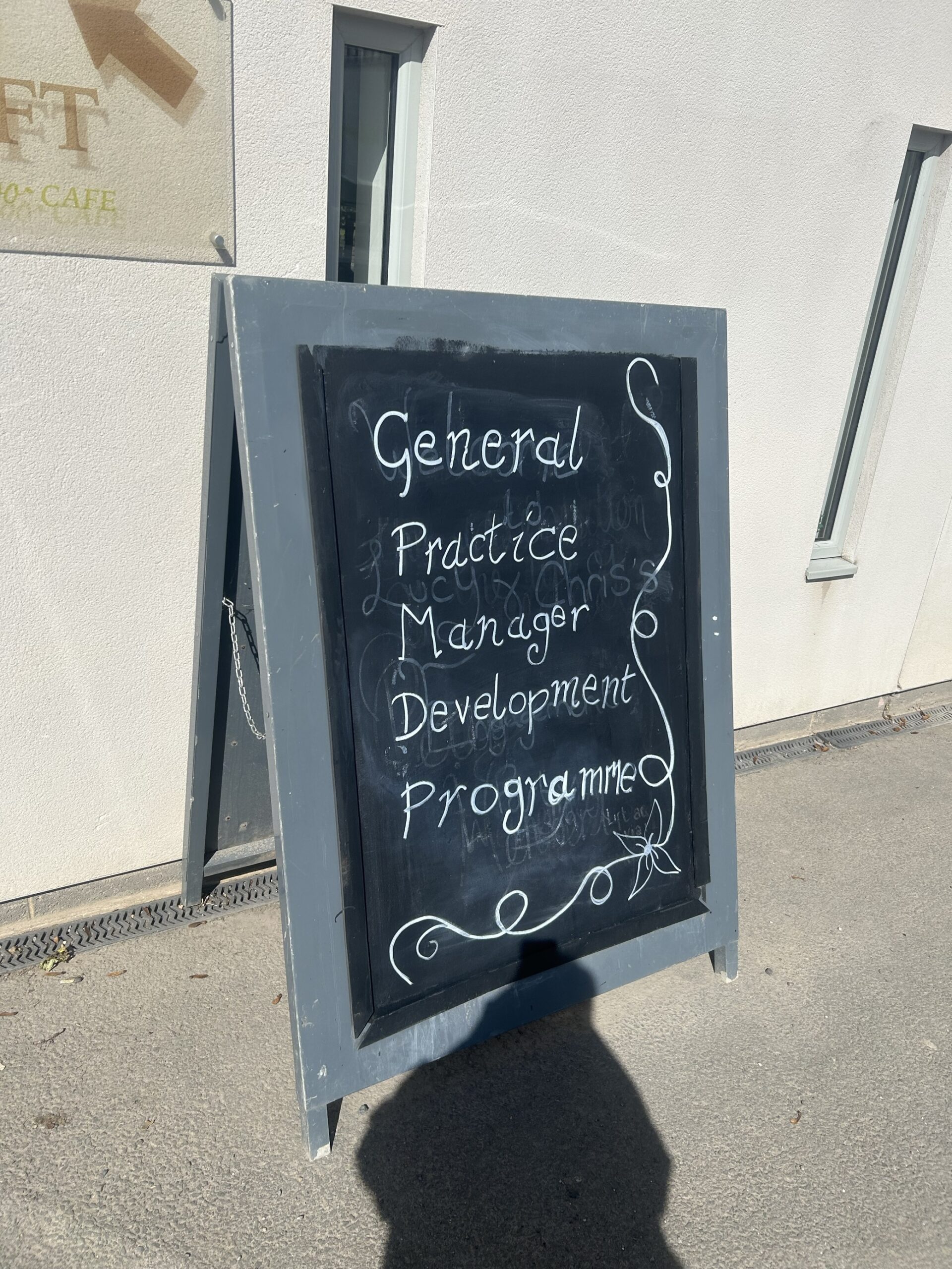 A sign with the words Practice Managers Development Programme written on it