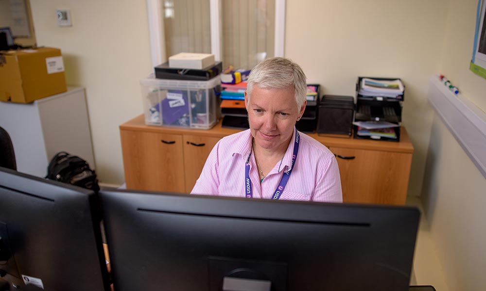 Colleague working at a computer.