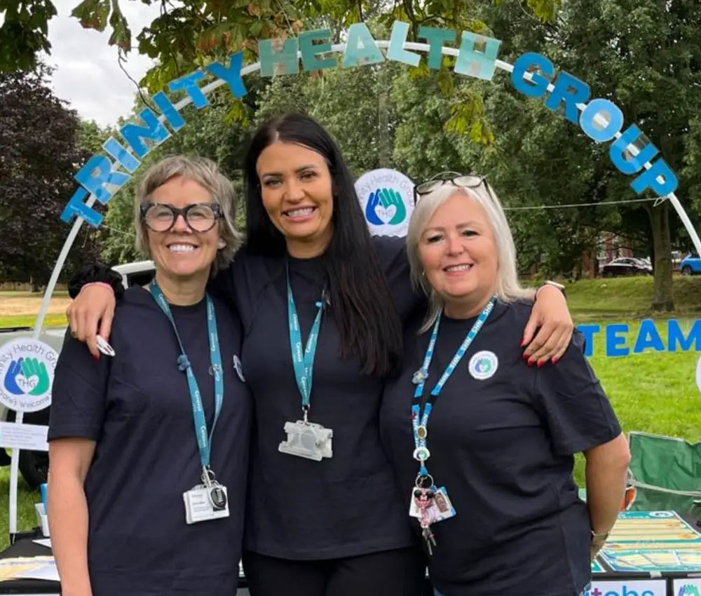 Three colleagues at Trinity Health Group.